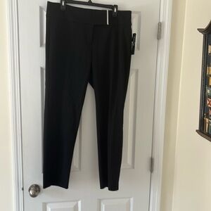 Black machine washable stretch pants in a size 14w by
Alfani
